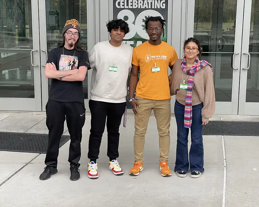 A photo of four UT undergrad Physics students at their ORNL Undergrad Student Tour