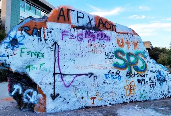 Society of Physics Students painted their homework on The Rock at UT