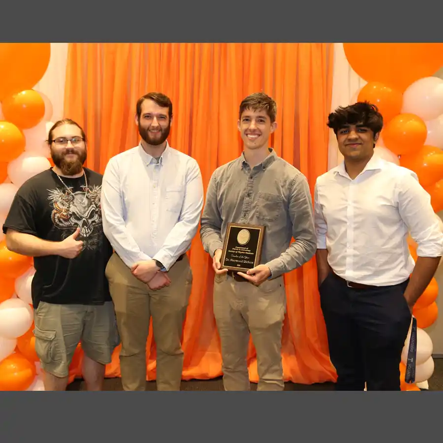 Photo of Sherwood Richers with Gage Erwin, Zach Patton, and Raghav Chari