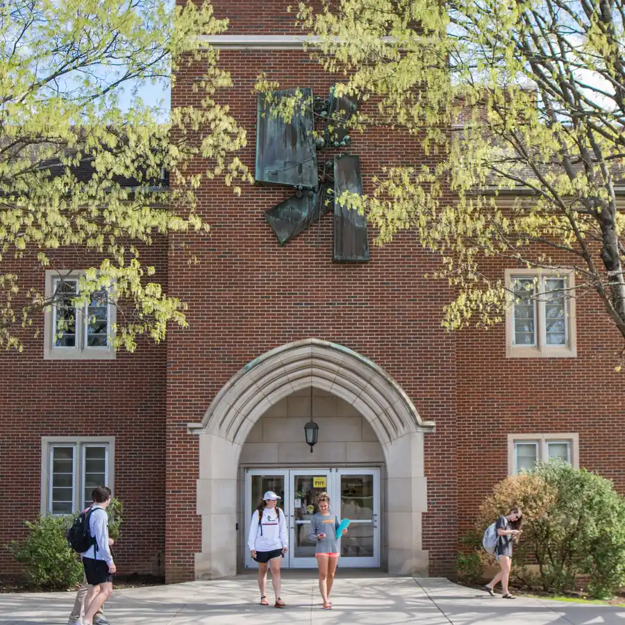 Students stand in front of the Nielsen Physics Building on the University of Tennessee, Knoxville, campus