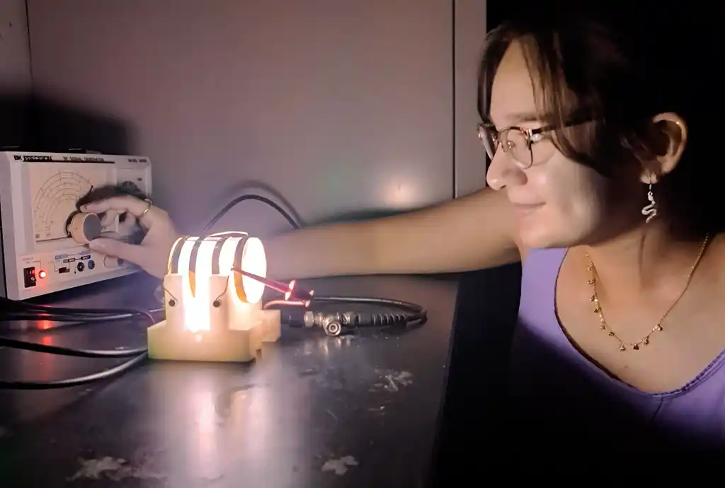 A photo of a student in a physics lab