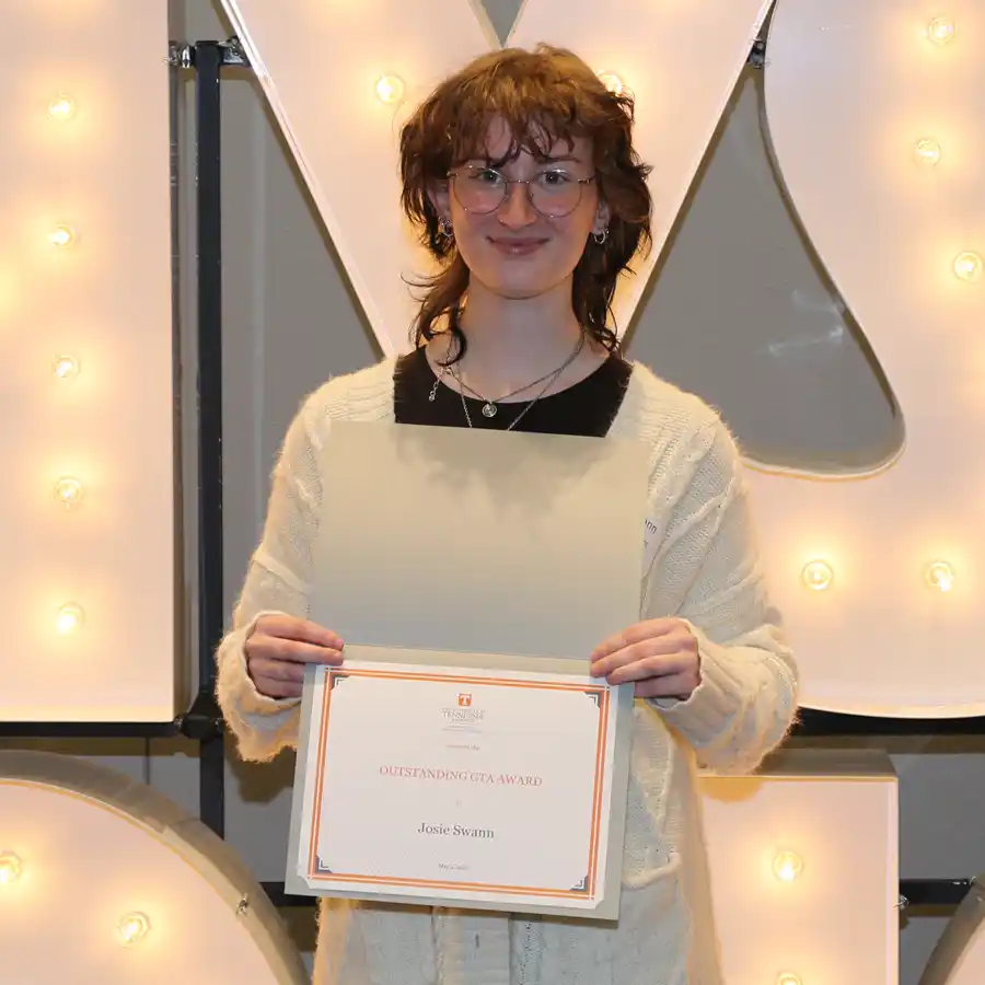 A photo of Josie Swann with her 2026 UT Physics Honors Day certificate