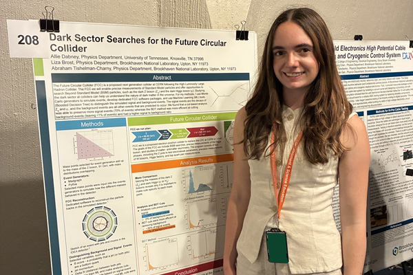 A photo of Allie Dabney presenting a poster of her SULI research